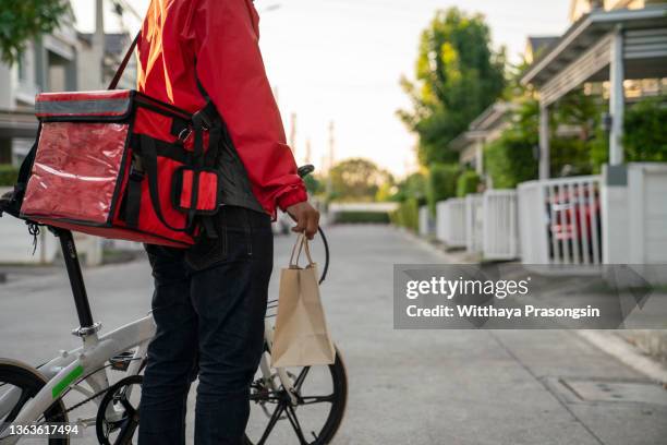 food delivery - bicycle messenger stock pictures, royalty-free photos & images