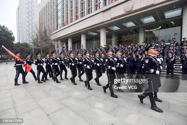 The police of Wuhan Public Security Bureau hold a police flag-raising ceremony on January 9, 2022 in Wuhan, Hubei Province of China. Activities are...