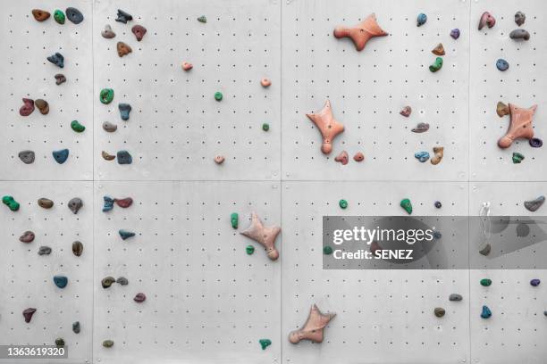 full frame shot of climbing wall - indoor climbing stock-fotos und bilder