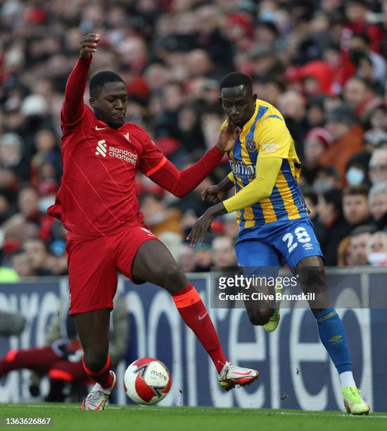 Ibrahima Konate of Liverpool battles for possession with Saikou Janneh of Shrewsbury Town during the Emirates FA Cup Third Round match between...