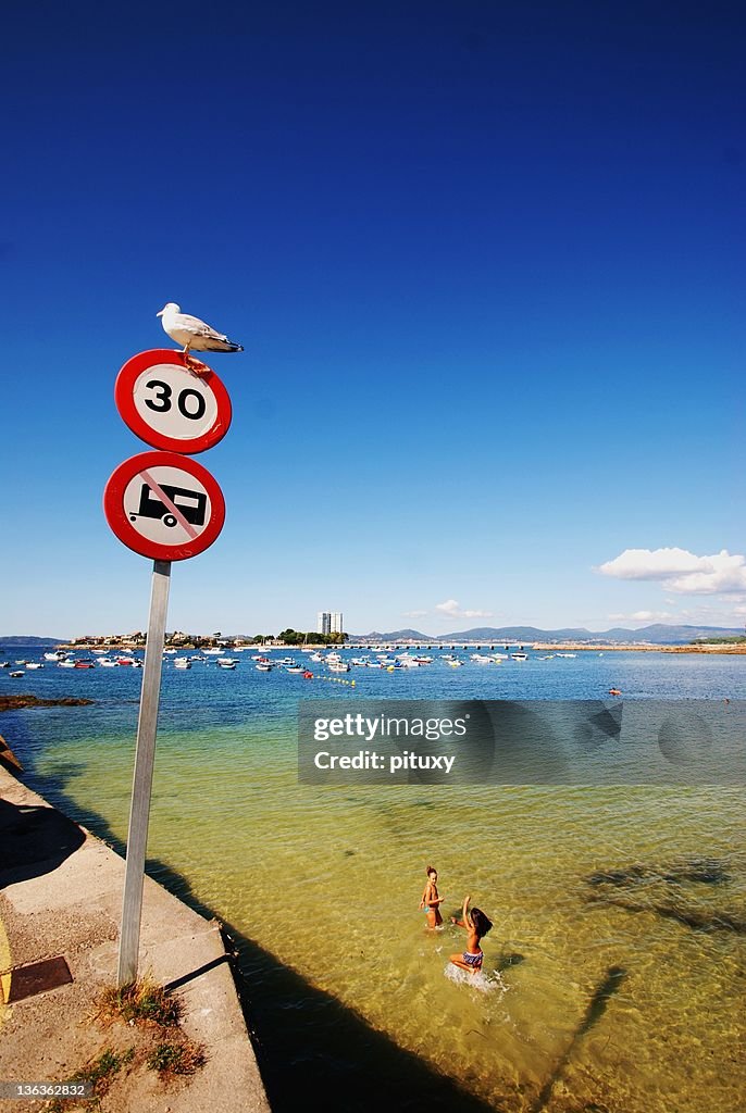 Two girls playing in sea