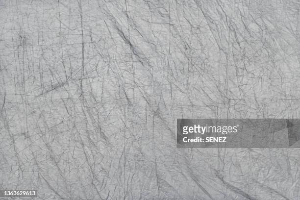 full frame shot of grey tarpaulin - plane stock-fotos und bilder