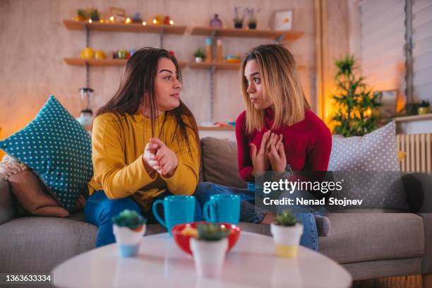 young gay woman arguing with her girlfriend - friends arguing stock pictures, royalty-free photos & images