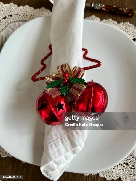 rolled napkin with a christmas napkin ring - napkin ring stock pictures, royalty-free photos & images