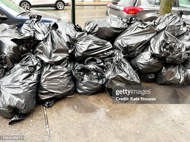 garbage in new york - garbage bag stock pictures, royalty-free photos & images