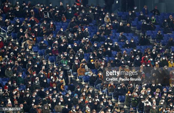 Fans wear face masks inside the stadium during the Serie A match between AS Roma v Juventus at Stadio Olimpico on January 09, 2022 in Rome, Italy.