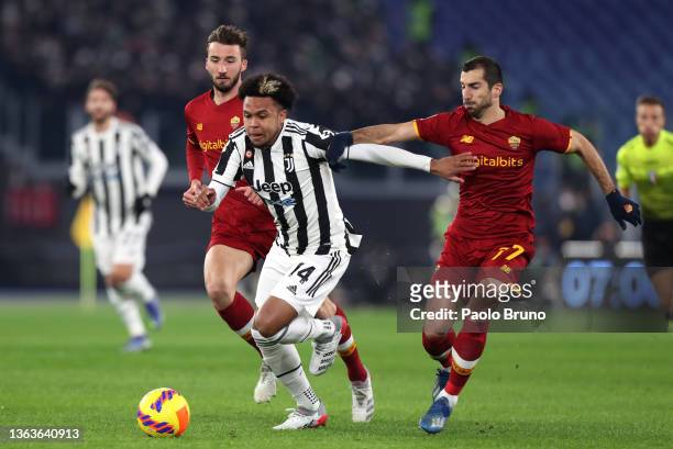 Weston McKennie of Juventus is closed down by Henrikh Mkhitaryan of AS Roma during the Serie A match between AS Roma v Juventus at Stadio Olimpico on...