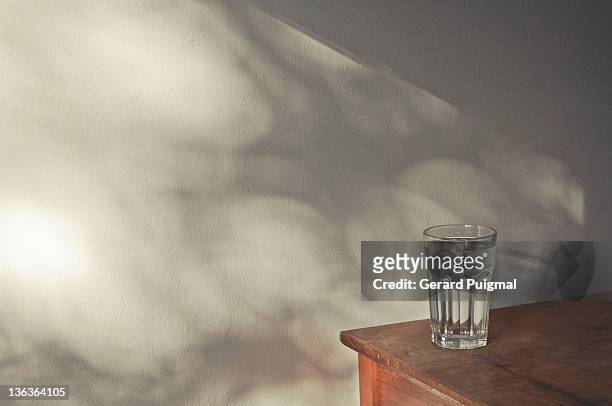 glass on table - drinking glass stock pictures, royalty-free photos & images