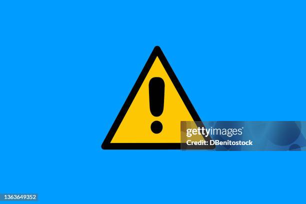 warning sign with yellow and black triangle with exclamation mark, on blue background. danger, risk, caution, attention, road sign and care concept. - señal de información fotografías e imágenes de stock