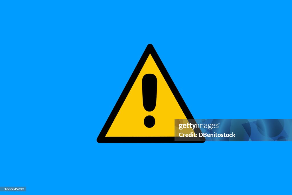 Warning sign with yellow and black triangle with exclamation mark, on blue background. Danger, risk, caution, attention, road sign and care concept.