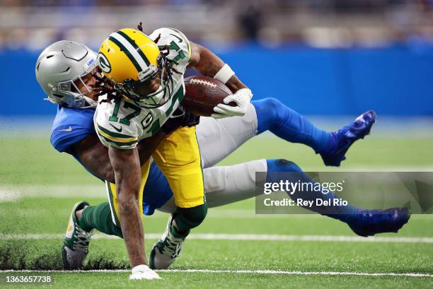 Davante Adams of the Green Bay Packers carries the ball after a reception during the first half against the Detroit Lions at Ford Field on January...