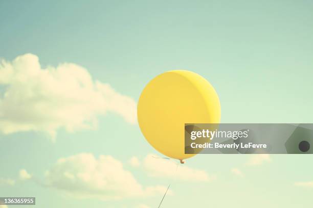 yellow balloon - balloon sky stock pictures, royalty-free photos & images