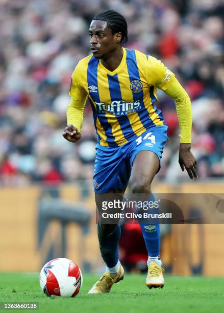 Nathanael Ogbeta of Shrewsbury Town runs with the ball during the Emirates FA Cup Third Round match between Liverpool and Shrewsbury Town at Anfield...