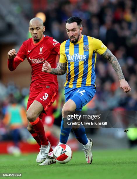 Ryan Bowman of Shrewsbury Town runs with the ball under pressure from Fabinho of Liverpool during the Emirates FA Cup Third Round match between...