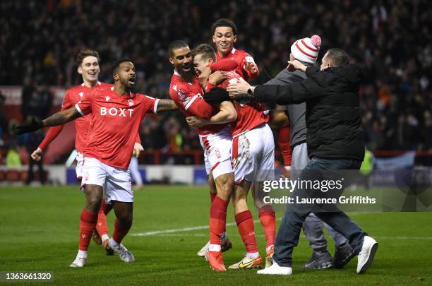 Lewis Grabban of Nottingham Forest celebrates with teammates and fans after scoring their side's first goal during the Emirates FA Cup Third Round...