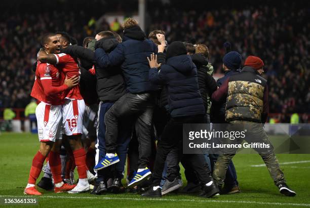Lewis Grabban of Nottingham Forest celebrates with teammates and fans after scoring their side's first goal during the Emirates FA Cup Third Round...