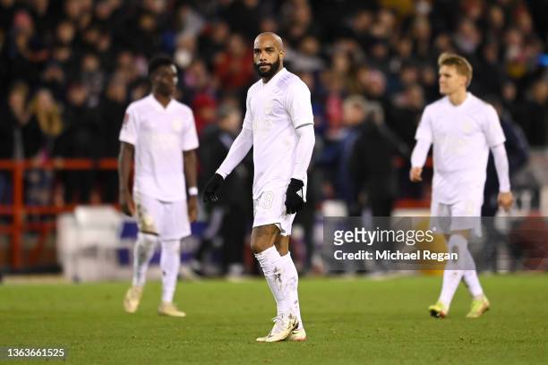 Alexandre Lacazette of Arsenal looks dejected following defeat in the Emirates FA Cup Third Round match between Nottingham Forest and Arsenal at City...