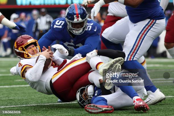 Taylor Heinicke of the Washington Football Team is sacked in the second quarter of the game against the New York Giants at MetLife Stadium on January...