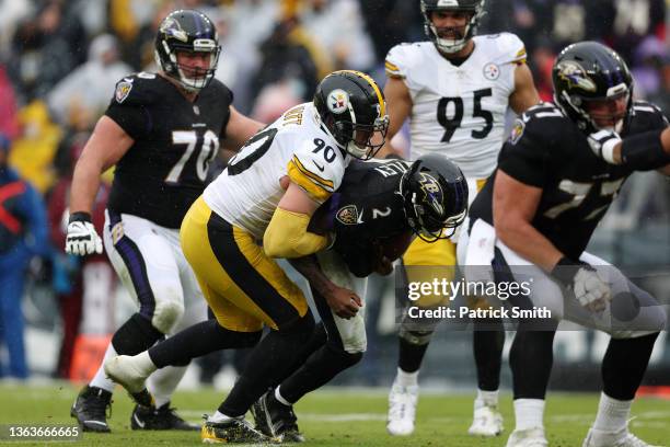 Watt of the Pittsburgh Steelers sacks Tyler Huntley of the Baltimore Ravens during the second quarter at M&T Bank Stadium on January 09, 2022 in...