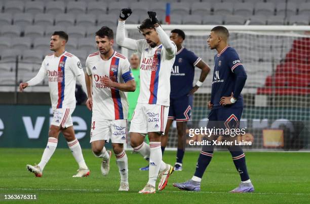 Lucas Paqueta of Lyon celebrates his goal as Kylian Mbappe of Paris Saint-Germain is disappointed during the Ligue 1 Uber Eats match between...