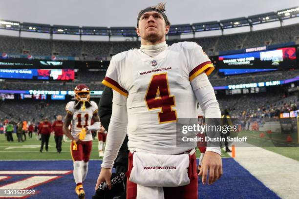 Taylor Heinicke of the Washington Football Team leaves the field after defeating the New York Giants 22-7 at MetLife Stadium on January 09, 2022 in...