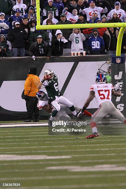 Defensive Tackle Chris Canty of the New York Giants sacks Quarterback Mark Sanchez of the New York Jets for a Safety when the New York Jets host the...