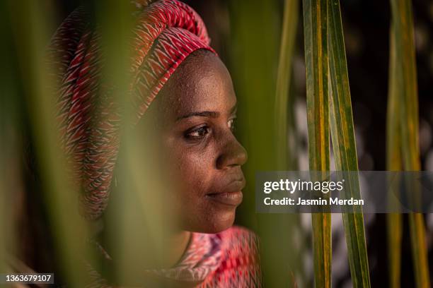 beauty in tropical leaves - muslim woman darkness stock pictures, royalty-free photos & images