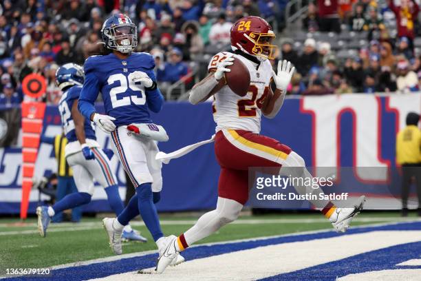 Antonio Gibson of the Washington Football Team runs into the end zone for a touchdown in the fourth quarter of the game against the New York Giants...