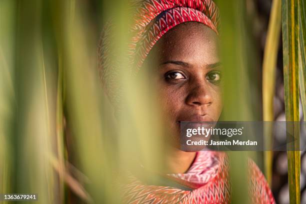 beauty in tropical leaves - muslim woman darkness stock pictures, royalty-free photos & images