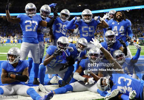 The Detroit Lions defense celebrates after Tracy Walker III of the Detroit Lions made an interception against the Green Bay Packers during the fourth...