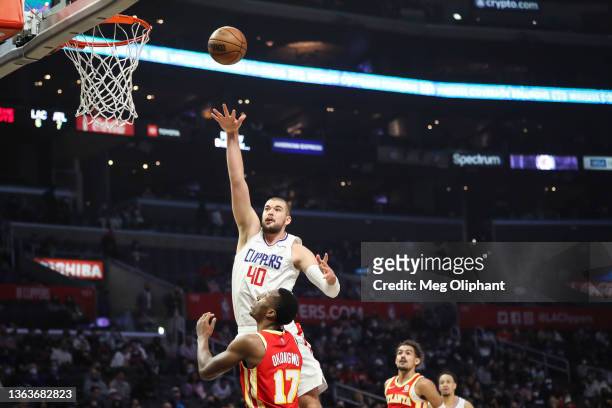 Ivica Zubac of the LA Clippers shoots over Onyeka Okongwu of the Atlanta Hawks in the first half at Crypto.com Arena on January 09, 2022 in Los...