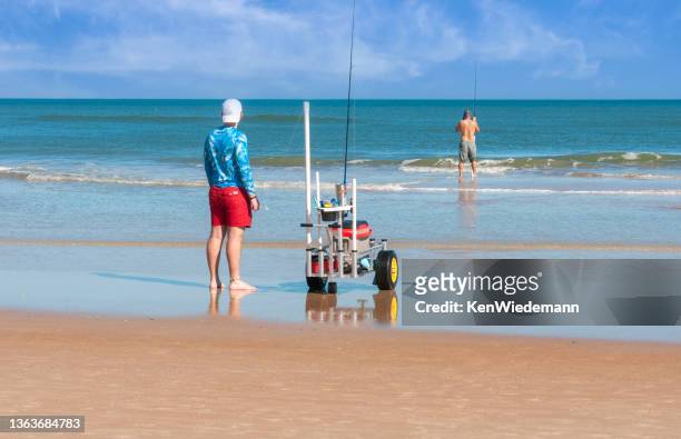 daytona beach fishermen - surf casting stock pictures, royalty-free photos & images