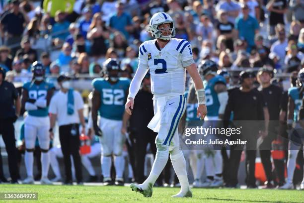 Carson Wentz of the Indianapolis Colts looks up at the score board during the fourth quarter in the game against the Jacksonville Jaguars at TIAA...