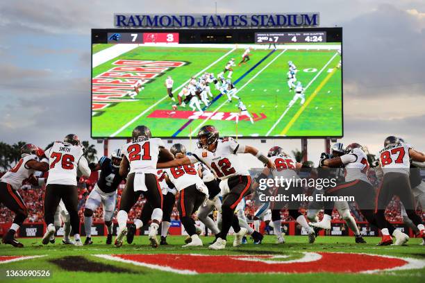 Tom Brady of the Tampa Bay Buccaneers hands the ball off to Ke'Shawn Vaughn of the Tampa Bay Buccaneers during the second quarter against the...