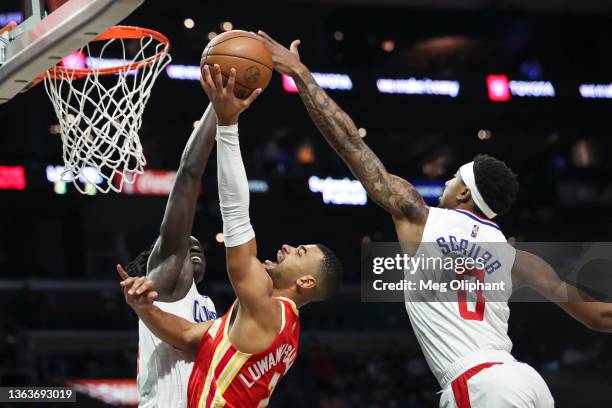 Timothe Luwawu-Cabarrot of the Atlanta Hawks is fouled by Wenyen Gabriel of the LA Clippers in the second half at Crypto.com Arena on January 09,...