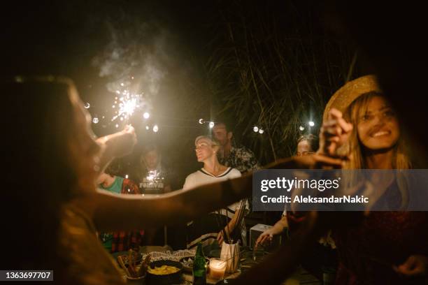 celebrating together - night picnic stock pictures, royalty-free photos & images