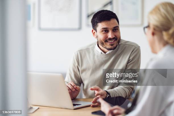 home office: man and woman having a meeting - person in education stock pictures, royalty-free photos & images