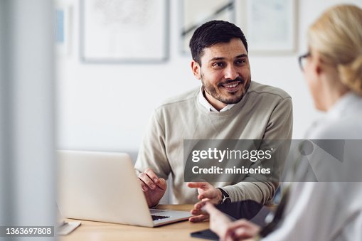 Home Office: Man and Woman Having a Meeting Home Office: Man and Woman Having a Meeting