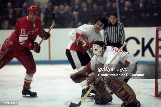 Goalie Tony Esposito and Brad Park of Canada defend the net as Alexander Yakushev of the Soviet Union looks to score during the 1972 Summit Series at...