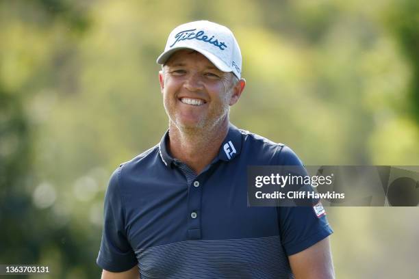 Matt Jones of Australia reacts after making his putt on the 17th hole during the final round of the Sentry Tournament of Champions at the Plantation...