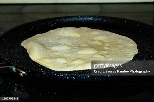 roti preparation - roti stock pictures, royalty-free photos & images