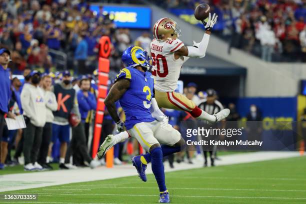 Ambry Thomas of the San Francisco 49ers makes a game-ending interception in overtime against the Los Angeles Rams at SoFi Stadium on January 09, 2022...
