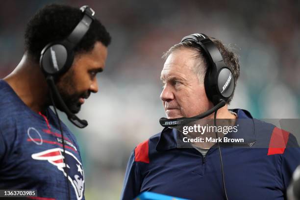 Head coach Bill Belichick of the New England Patriots and inside linebackers coach Jerod Mayo talk on the sidelines in the fourth quarter of the game...