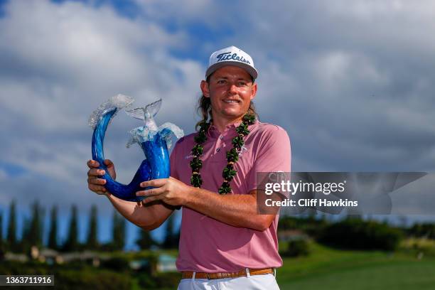 Cameron Smith of Australia celebrates with the trophy after winning during the final round of the Sentry Tournament of Champions at the Plantation...