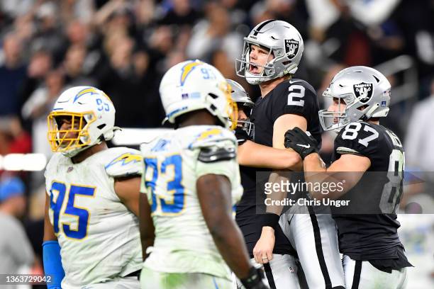 Daniel Carlson of the Las Vegas Raiders celebrates after kicking the game-winning field goal against the Los Angeles Chargers during overtime at...