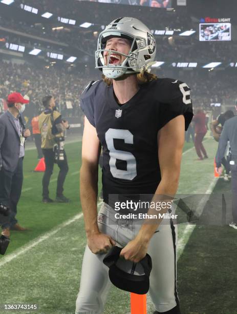Punter A.J. Cole of the Las Vegas Raiders celebrates as he runs off the field after the team's 35-32 overtime victory over the Los Angeles Chargers...