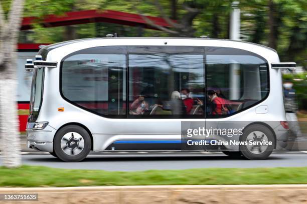 Citizens take a WeRide self-driving mini robobus for free at Guangzhou International Bio Island on January 9, 2022 in Guangzhou, Guangdong Province...