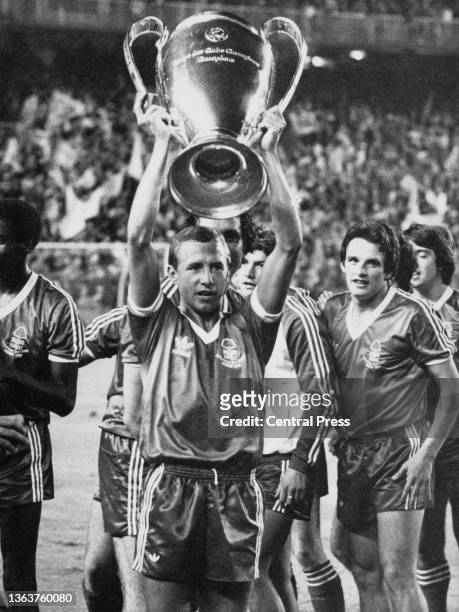John McGovern, team Captain of Nottingham Forest Football Club celebrates with the trophy after the European Cup Final between Nottingham Forest and...