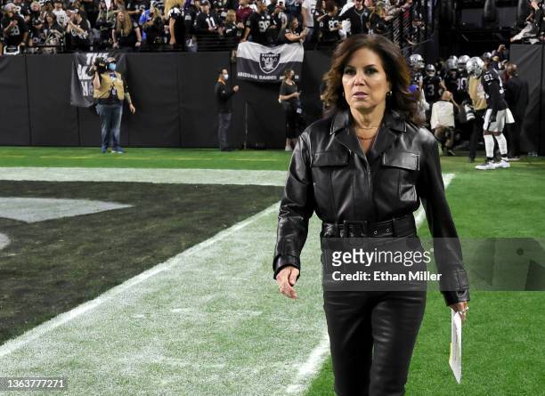Sunday Night Football" sideline reporter Michele Tafoya walks on the field before a game between the Los Angeles Chargers and the Las Vegas Raiders...