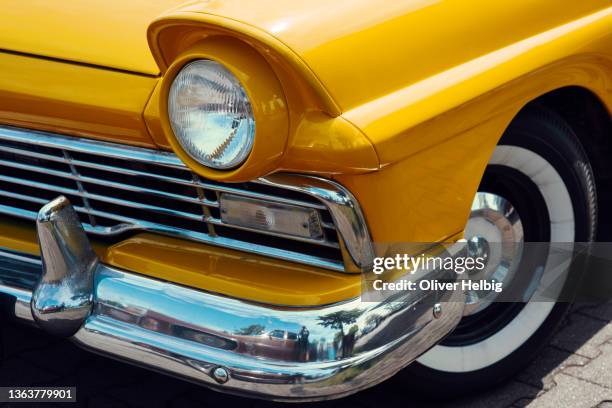 vintage us american car front detail. headlight and bumper of an old yellow car - old fashioned car stock pictures, royalty-free photos & images